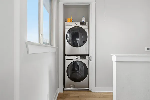 a view of a hallway with washer and dryer