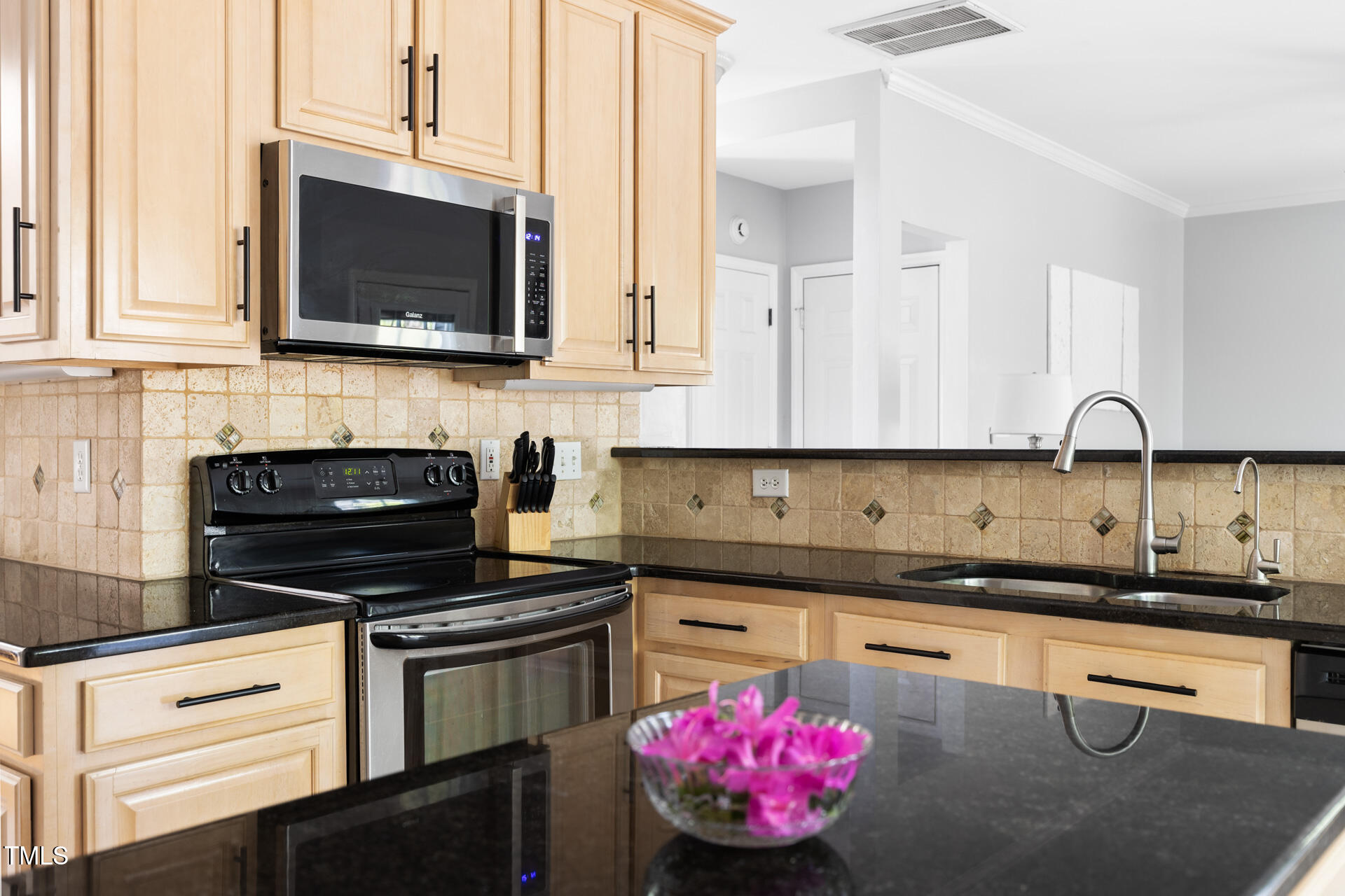 7 Wythebrook Lane Durham, NC 27713 - Photo 11 of 34 a kitchen with a sink cabinets and stainless steel appliances