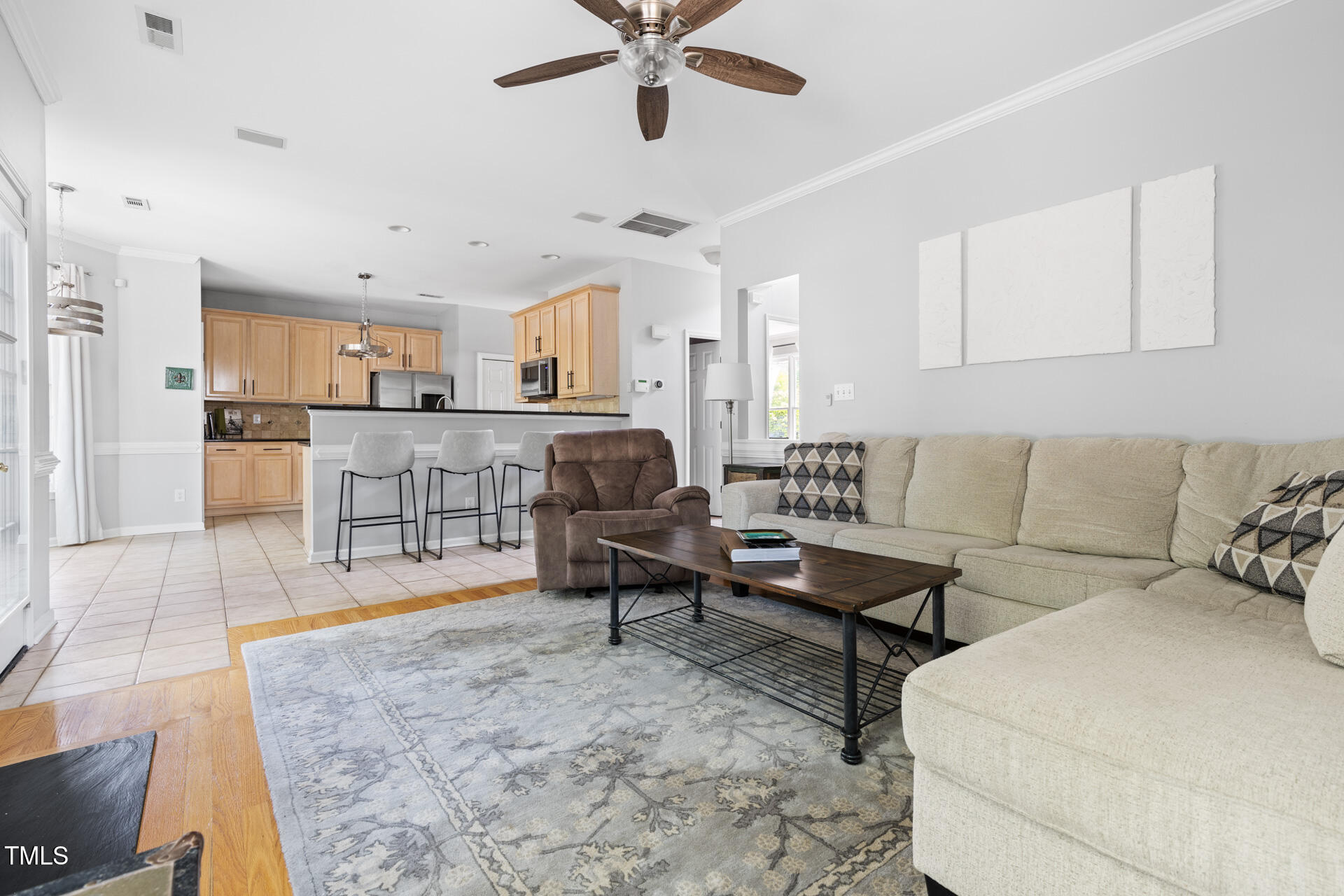 7 Wythebrook Lane Durham, NC 27713 - Photo 16 of 34 a living room with stainless steel appliances kitchen island granite countertop furniture and a kitchen view