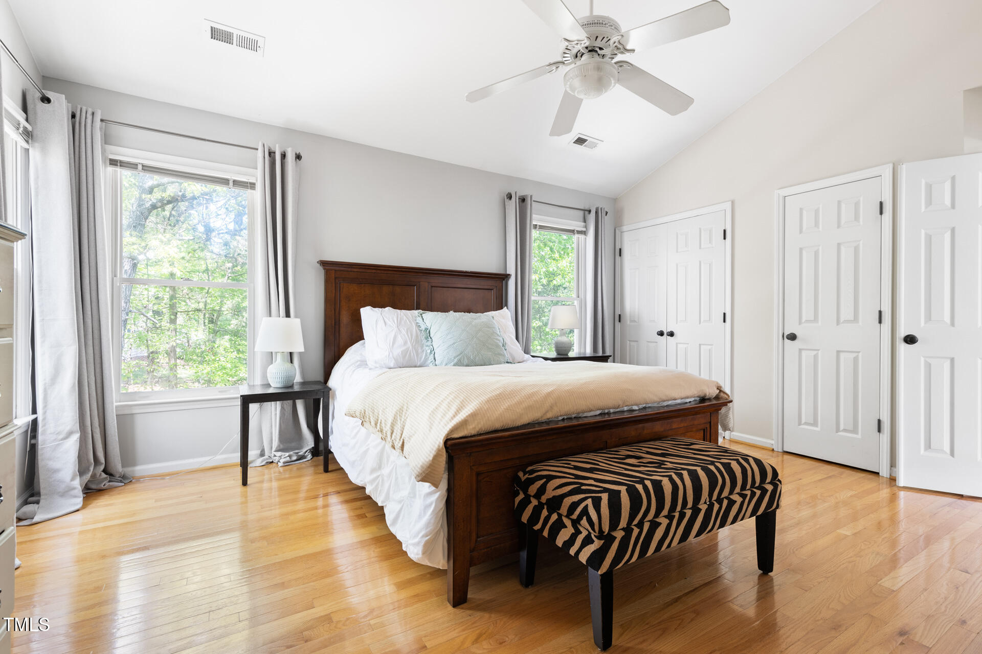 7 Wythebrook Lane Durham, NC 27713 - Photo 20 of 34 a bedroom with a bed and a chandelier