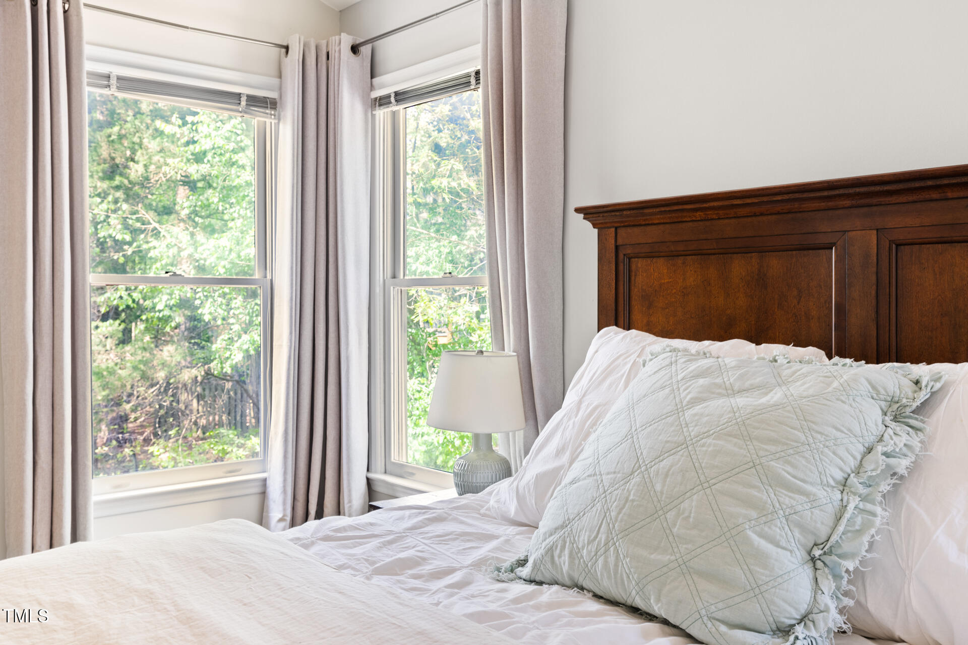 7 Wythebrook Lane Durham, NC 27713 - Photo 21 of 34 a large bed sitting in a bedroom next to a window