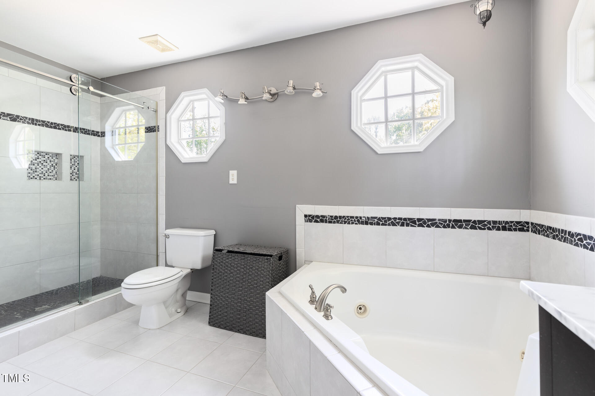 7 Wythebrook Lane Durham, NC 27713 - Photo 24 of 34 a bathroom with a toilet a sink and a mirror