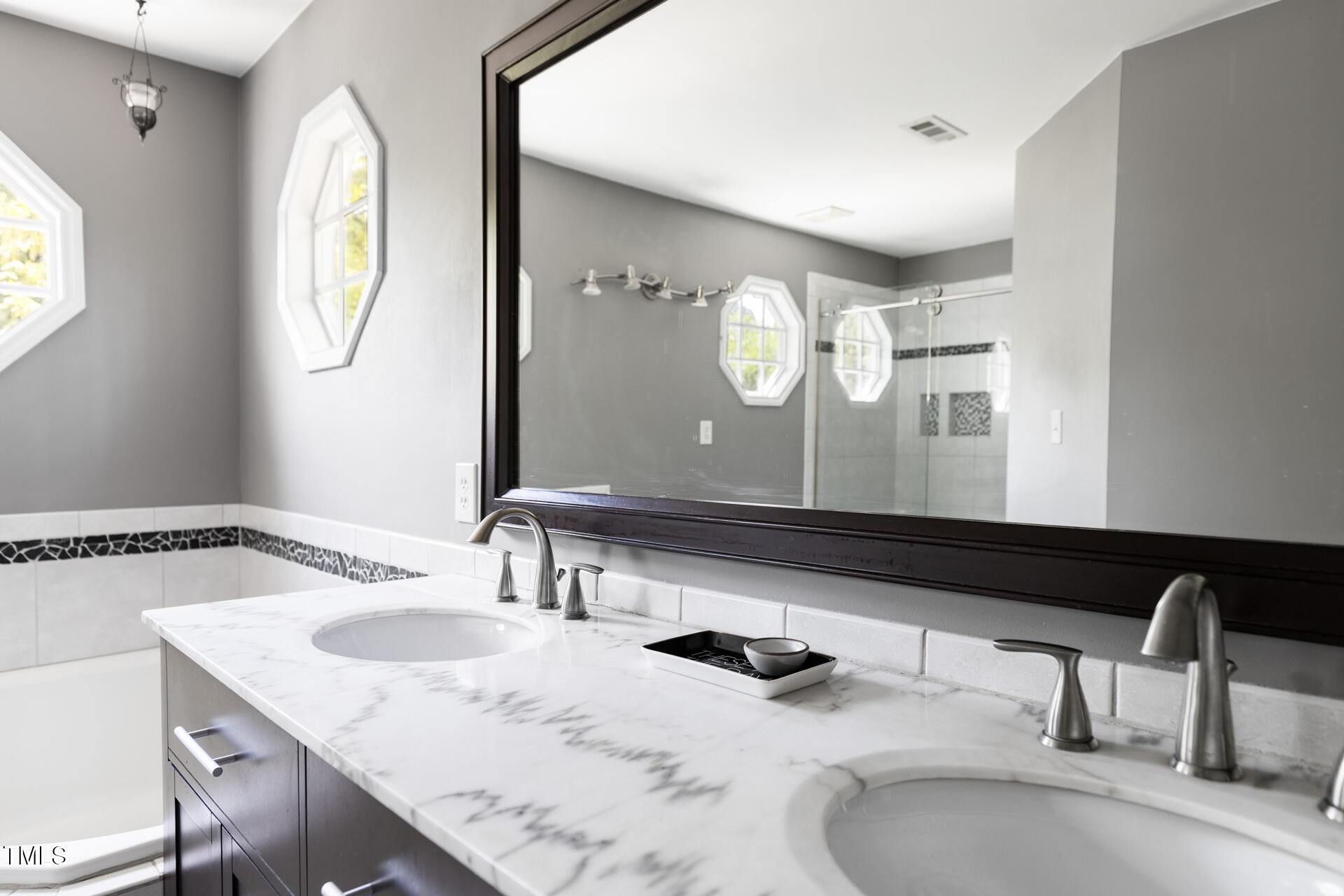 7 Wythebrook Lane Durham, NC 27713 - Photo 26 of 34 a bathroom with a granite countertop sink and a mirror