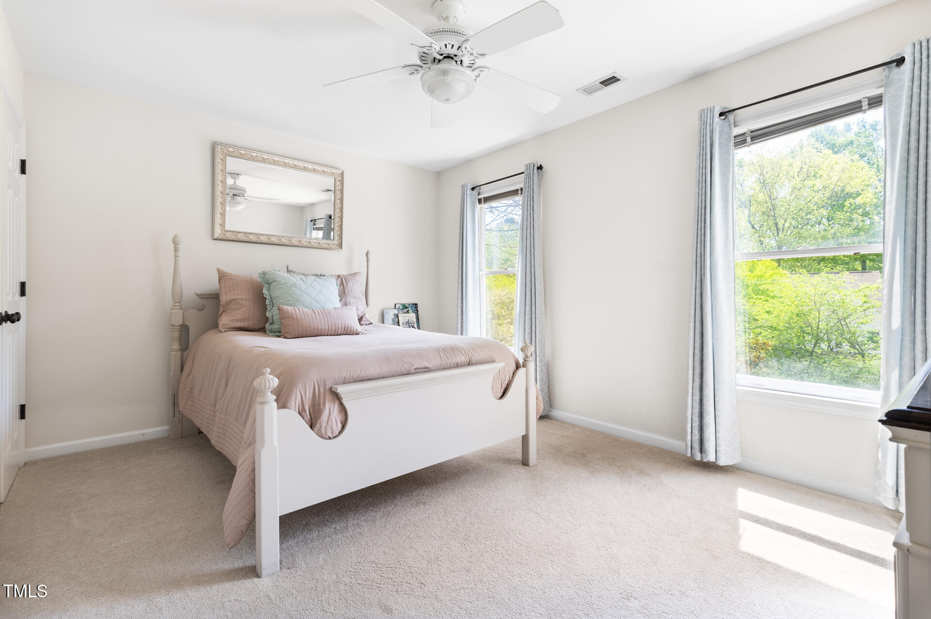 7 Wythebrook Lane Durham, NC 27713 - Photo 27 of 34 a bed sitting in a spacious bedroom next to a window
