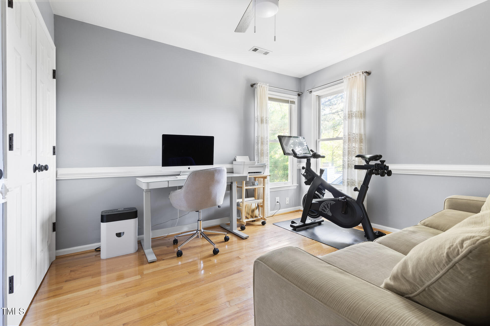 7 Wythebrook Lane Durham, NC 27713 - Photo 28 of 34 a living room with furniture a flat screen tv and a window