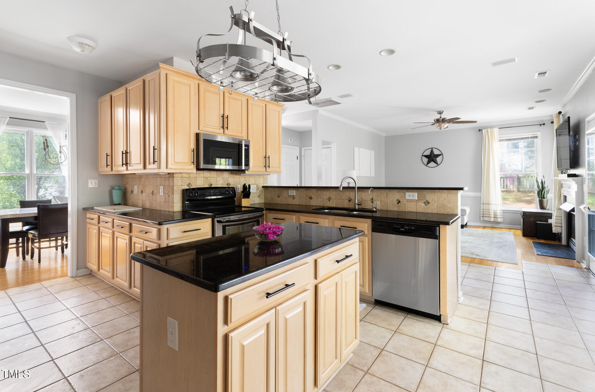 7 Wythebrook Lane Durham, NC 27713 - Photo 8 of 34 a kitchen with a stove cabinets and chairs