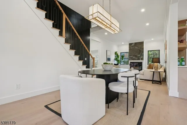 a dining room with furniture and wooden floor