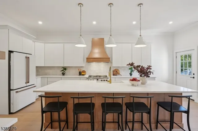 a kitchen with a table and chairs in it