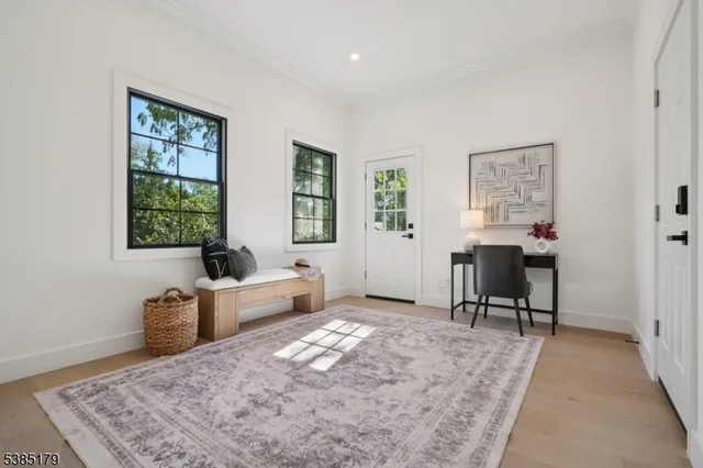 a bedroom with furniture and a window