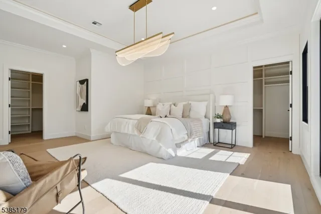 a bedroom with furniture and a rug