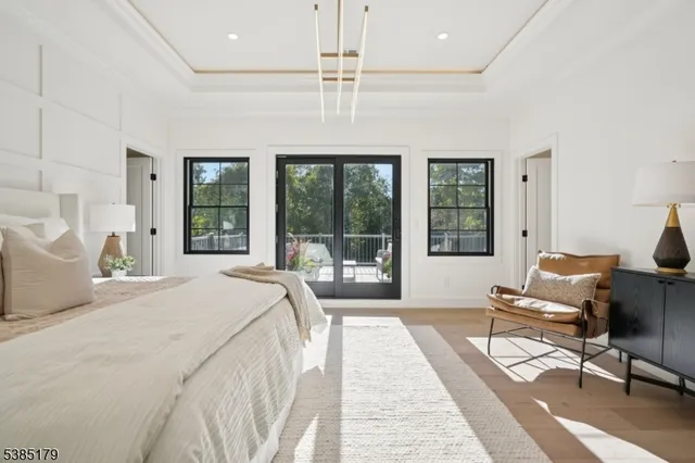 a spacious bedroom with a large bed and a large window