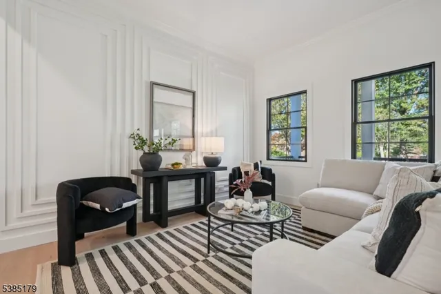 a living room with furniture and windows