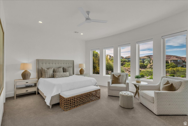 2608 Canyon Ridge Drive St. George, UT 84770 - Photo 70 of 86 Expansive bedroom featuring a tray ceiling with a ceiling fan, recessed lighting, and a neutral color palette