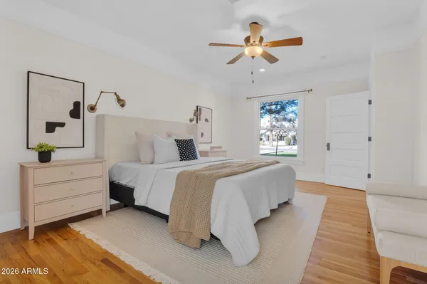 a bedroom with bed and window