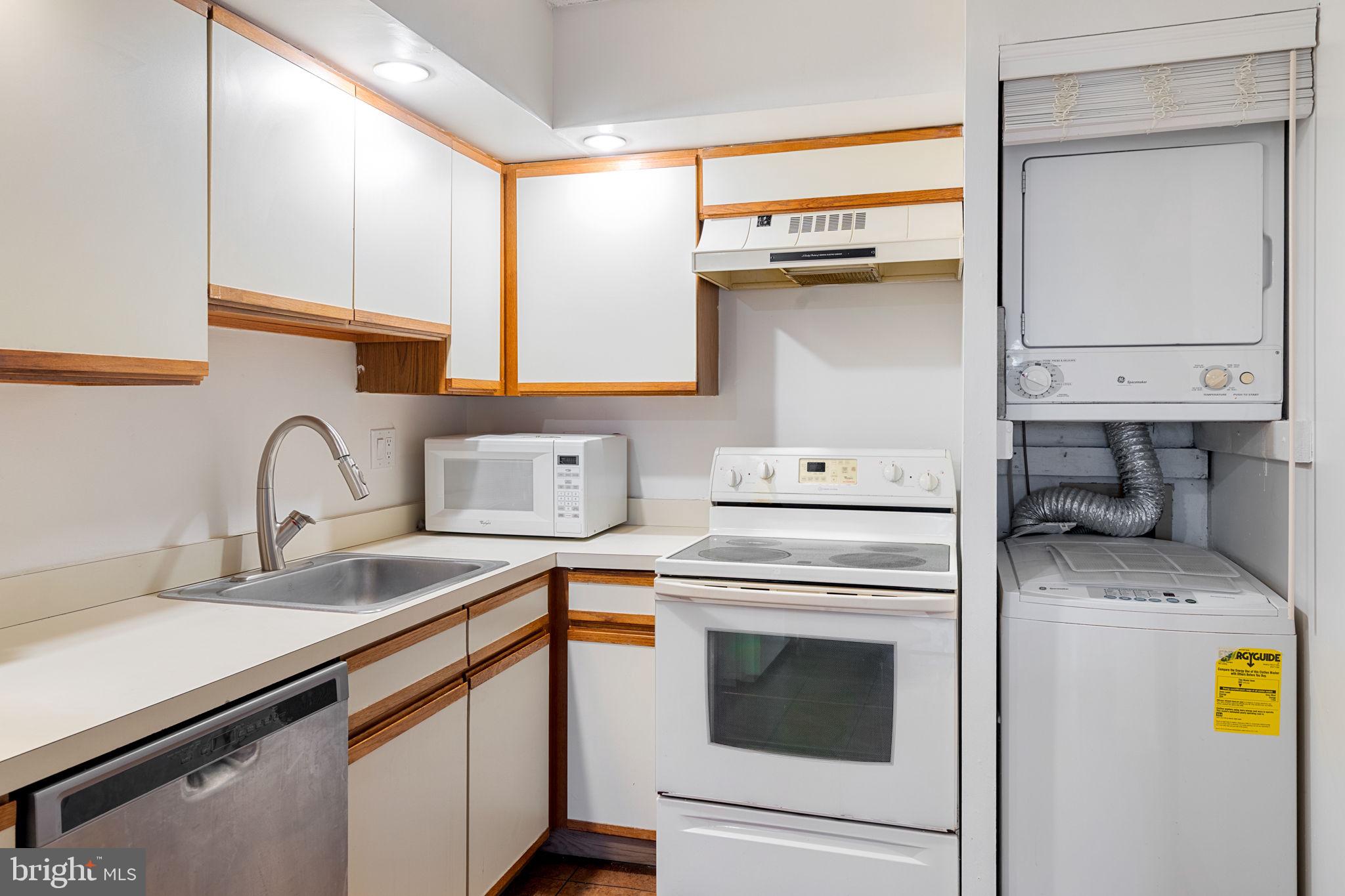 200 Lombard Street, Unit 602 Philadelphia, PA 19147 - Photo 14 of 32 a kitchen with a sink a stove and cabinets