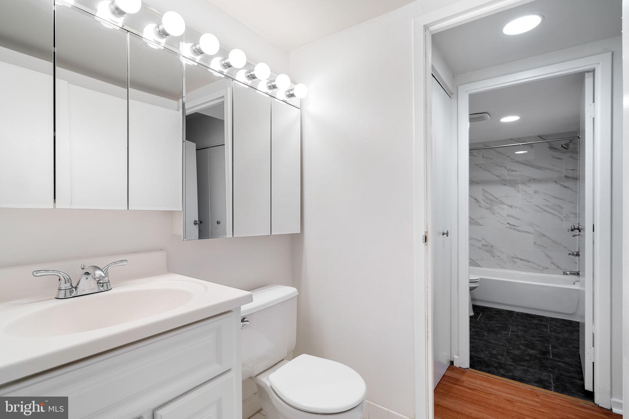 200 Lombard Street, Unit 602 Philadelphia, PA 19147 - Photo 15 of 32 a bathroom with a sink toilet and shower