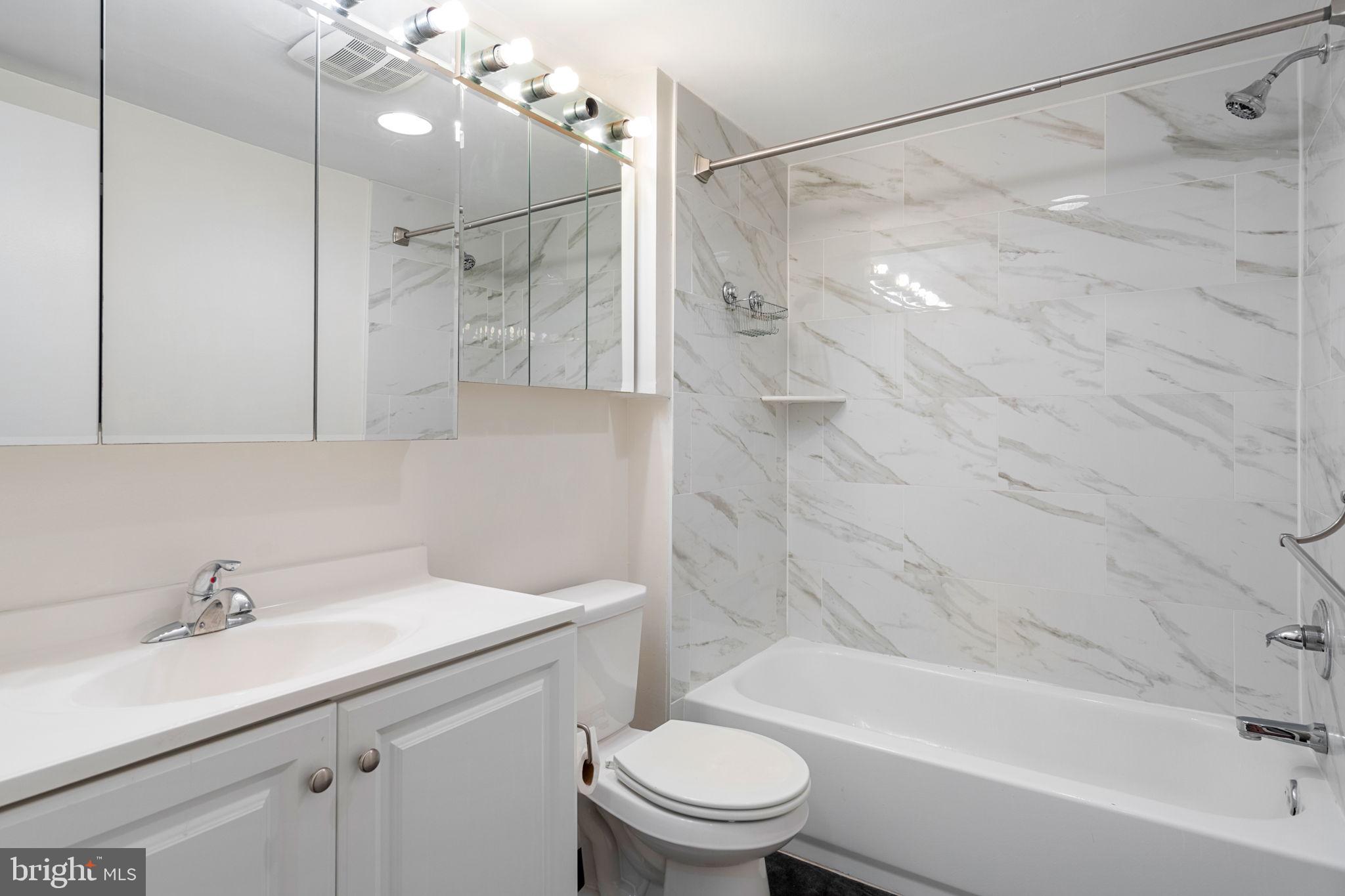 200 Lombard Street, Unit 602 Philadelphia, PA 19147 - Photo 16 of 32 a bathroom with a sink toilet and shower