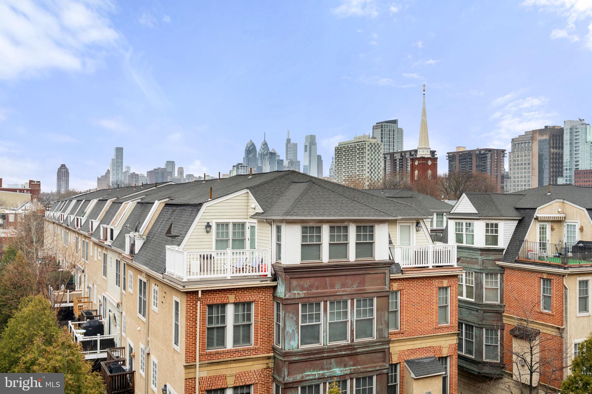 200 Lombard Street, Unit 602 Philadelphia, PA 19147 - Photo 24 of 32 a front view of a residential apartment building with a yard