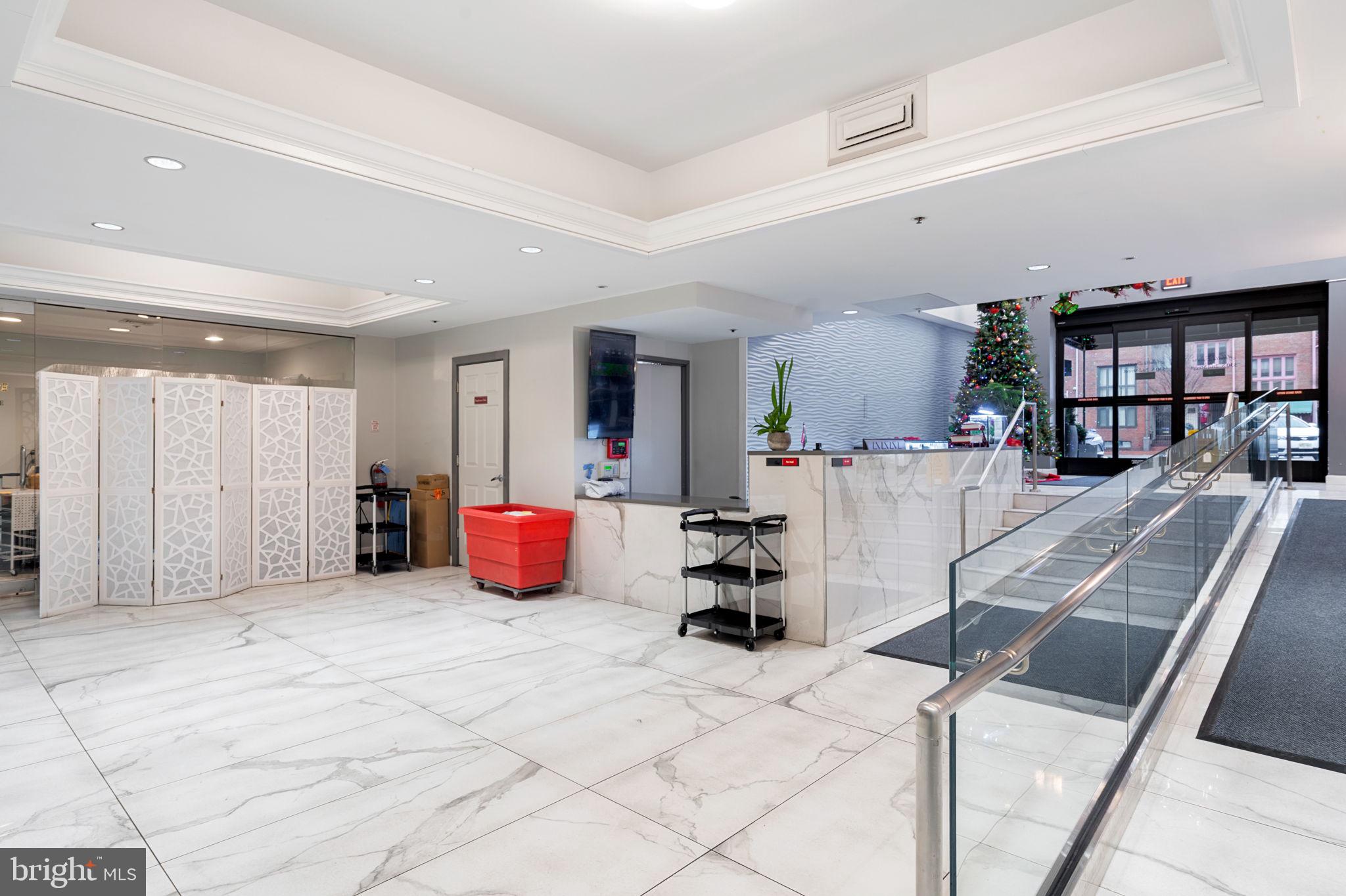 200 Lombard Street, Unit 602 Philadelphia, PA 19147 - Photo 32 of 32 a bedroom with furniture and a large window