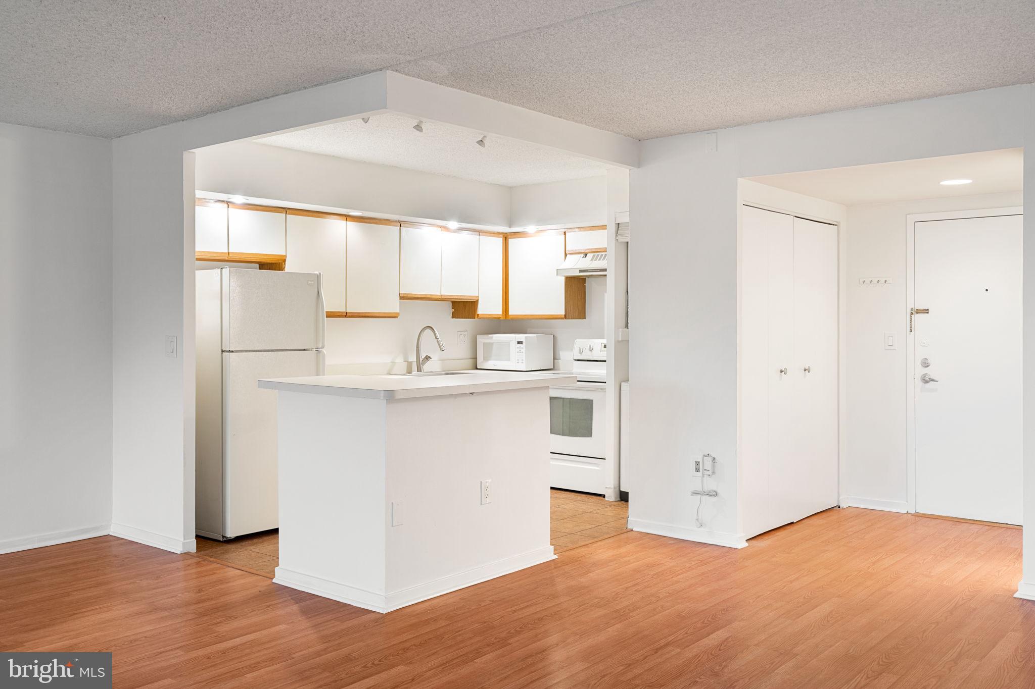 200 Lombard Street, Unit 602 Philadelphia, PA 19147 - Photo 7 of 32 a kitchen with stainless steel appliances a refrigerator and a stove