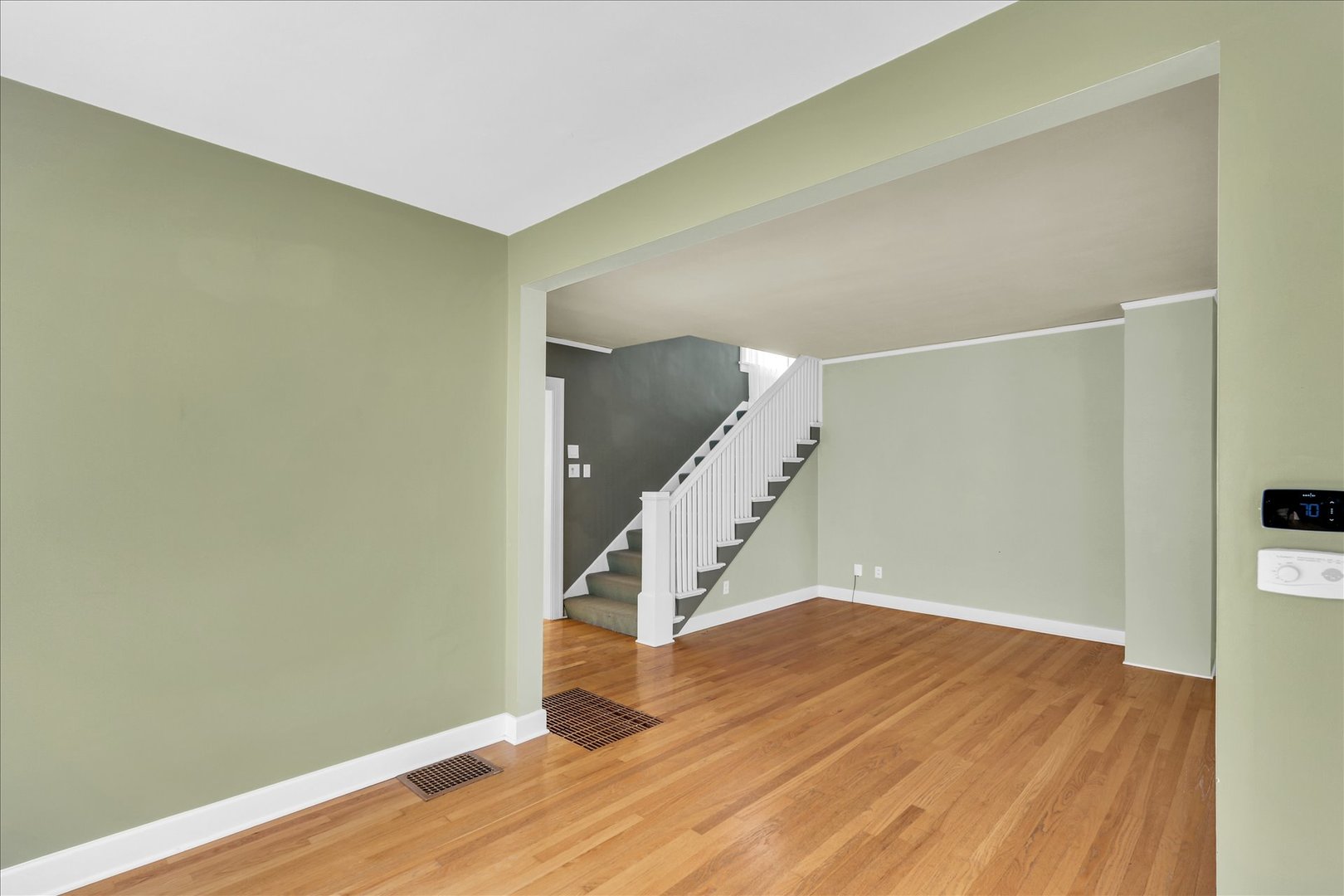 911 West Daniel Street Champaign, IL 61821 - Photo 11 of 44 an empty room with wooden floor and entryway