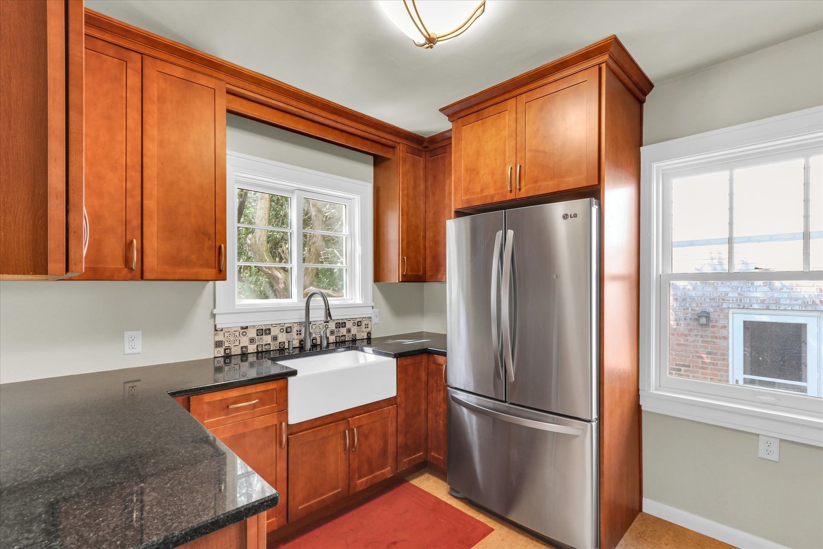 911 West Daniel Street Champaign, IL 61821 - Photo 20 of 44 a kitchen with stainless steel appliances granite countertop a refrigerator and a sink