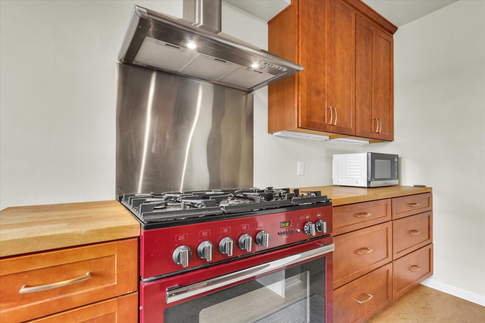 911 West Daniel Street Champaign, IL 61821 - Photo 23 of 44 a kitchen with granite countertop a stove and a sink