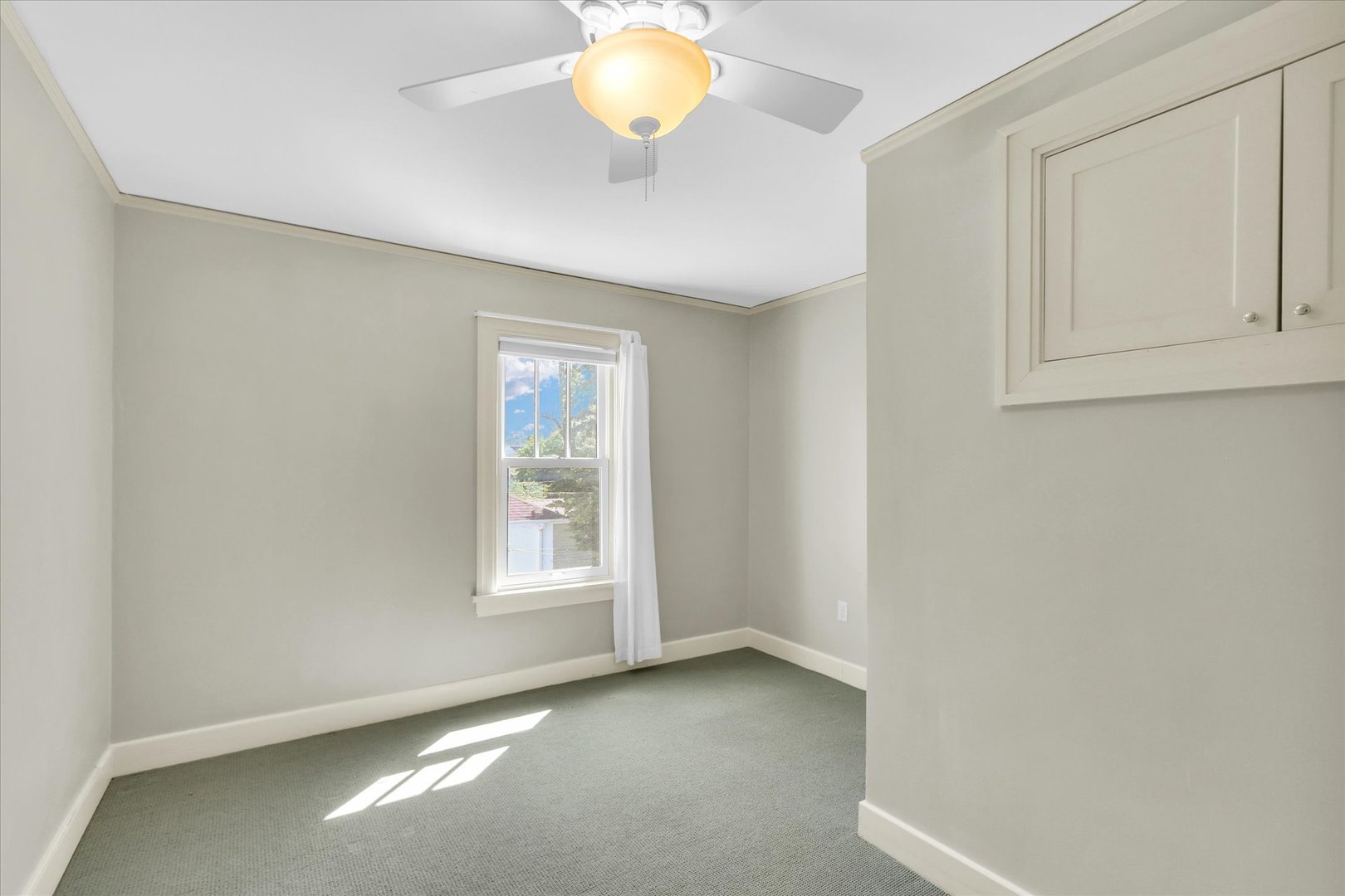 911 West Daniel Street Champaign, IL 61821 - Photo 24 of 44 an empty room with windows and closet