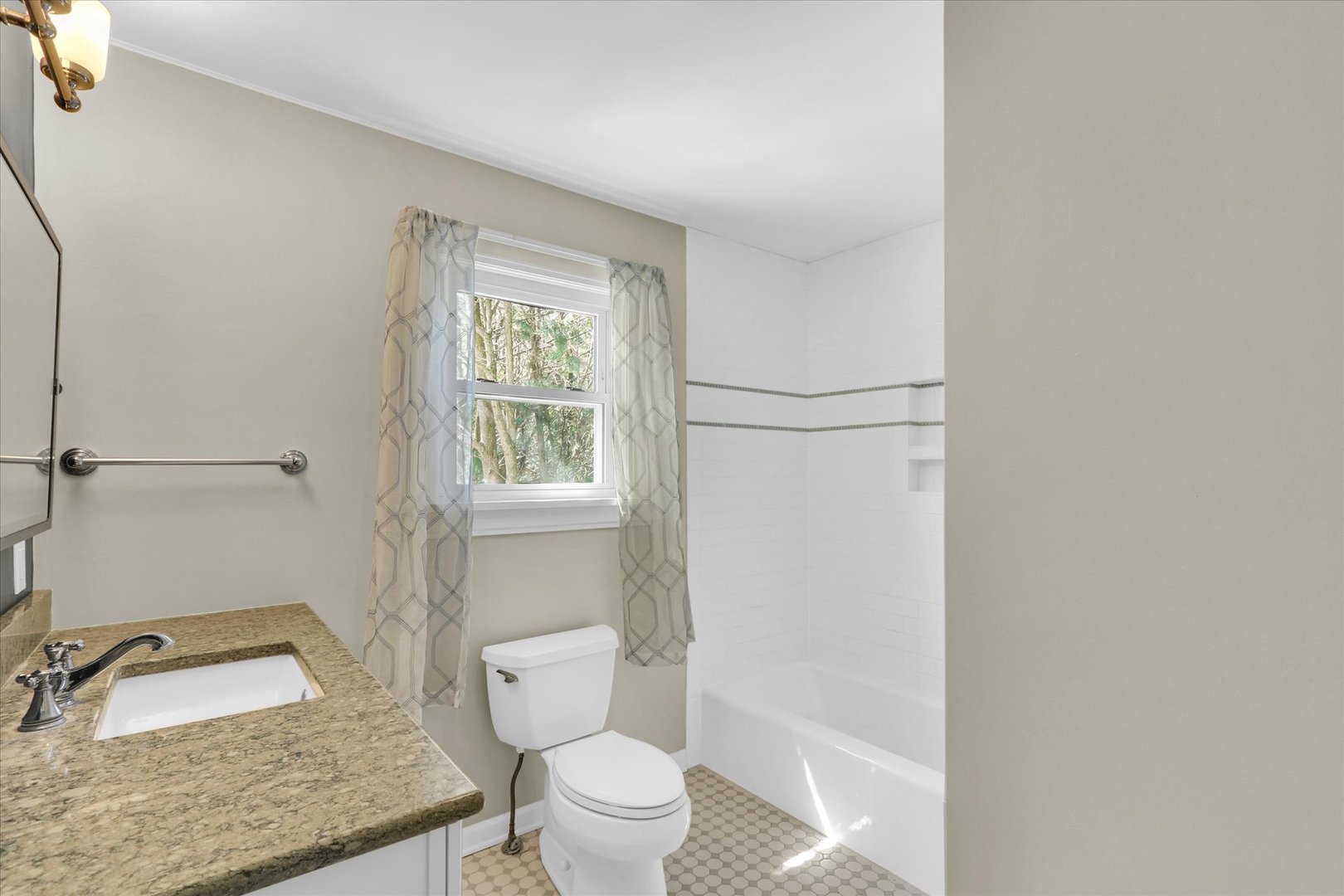 911 West Daniel Street Champaign, IL 61821 - Photo 31 of 44 a bathroom with a toilet sink and mirror
