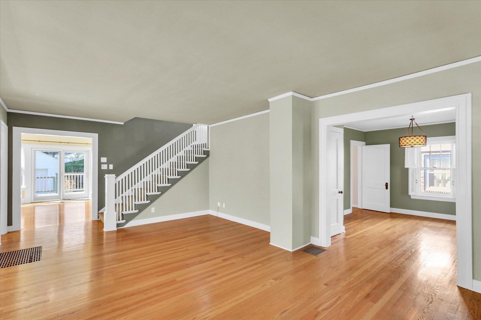 911 West Daniel Street Champaign, IL 61821 - Photo 7 of 44 a view of an entryway with wooden floor