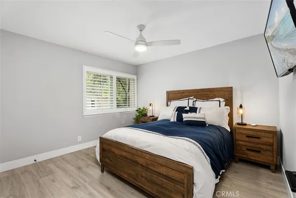 a bedroom with bed and a window