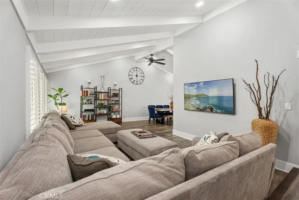 a view of entryway livingroom and hall with wooden floor