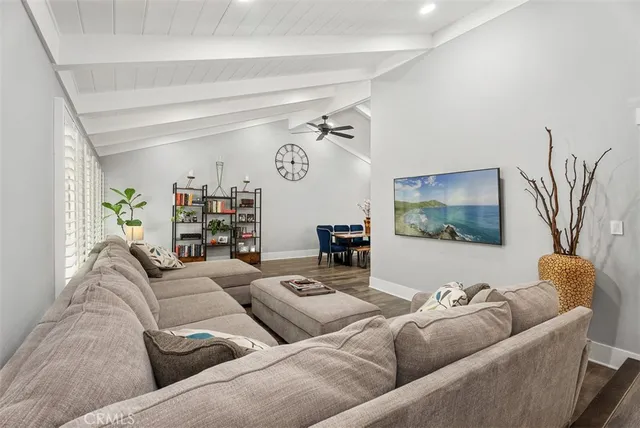a view of entryway livingroom and hall with wooden floor