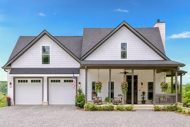 a view of a house with small yard plants and outdoor space