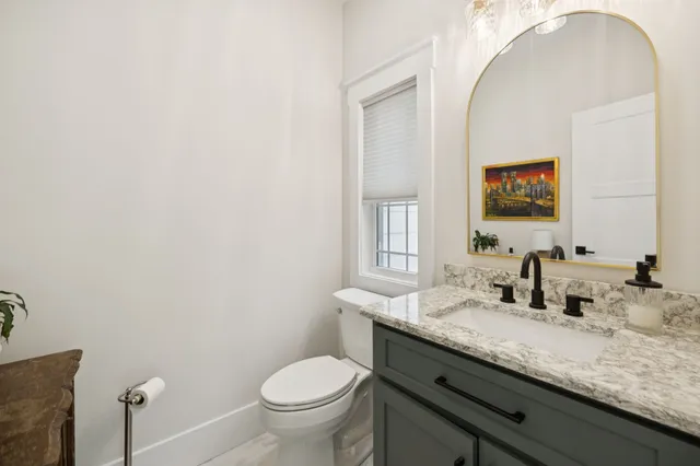 a white bath tub sitting next to a window
