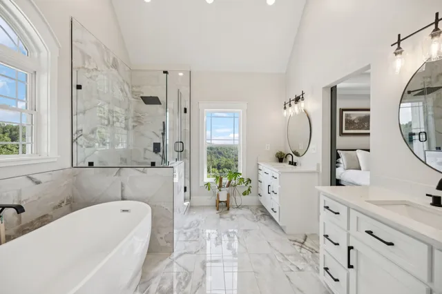 a white toilet sitting next to a bath tub