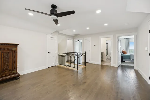 a spacious bedroom with a bed and a couch