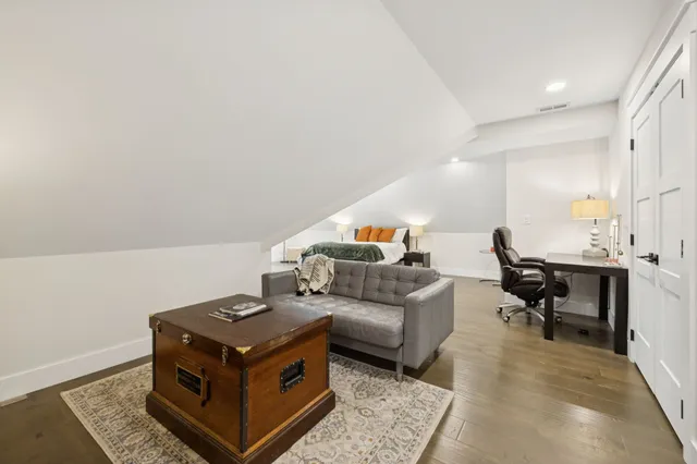 a view of a hallway with a wooden floors