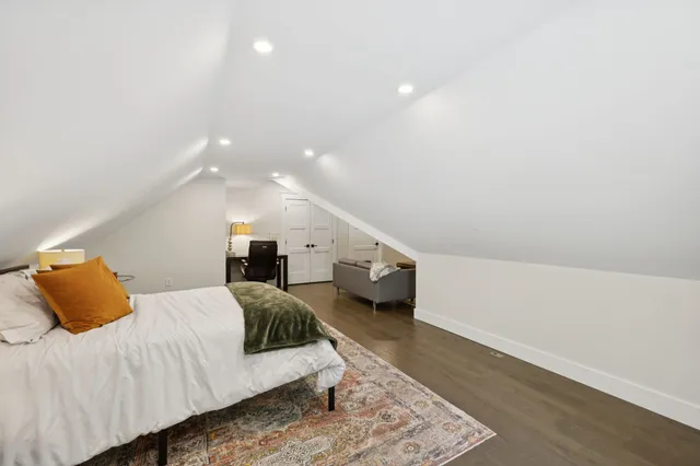 a living room with furniture fireplace and a flat screen tv