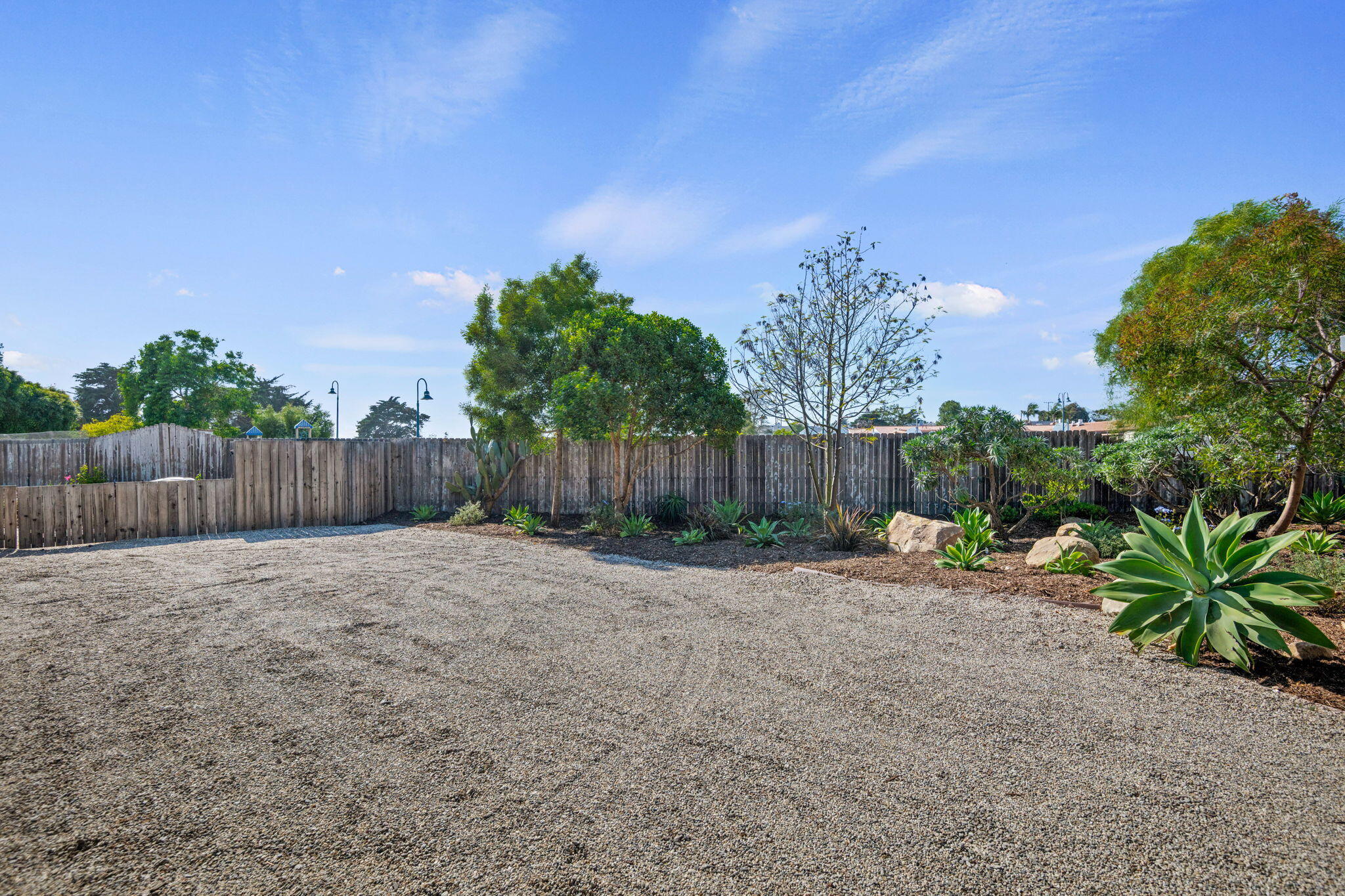 4621 7th Street Carpinteria, CA 93013 - Photo 14 of 16 a backyard of a house with lots of green space