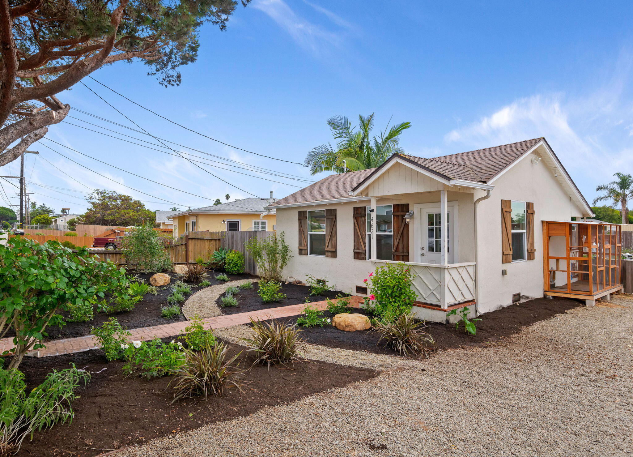 4621 7th Street Carpinteria, CA 93013 - Photo 2 of 16 a view of a house with backyard sitting area and garden