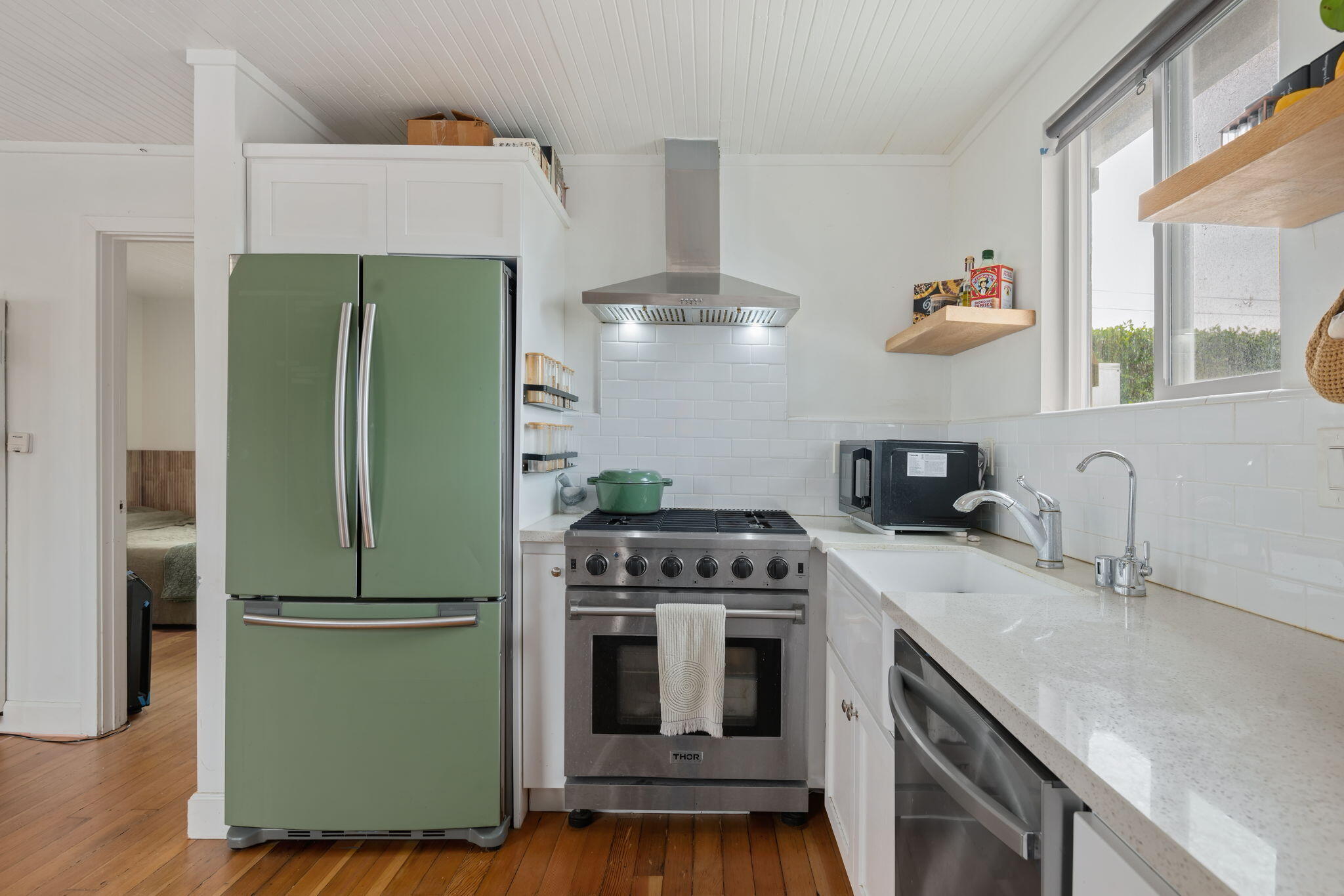 4621 7th Street Carpinteria, CA 93013 - Photo 5 of 16 a kitchen with cabinets and stainless steel appliances