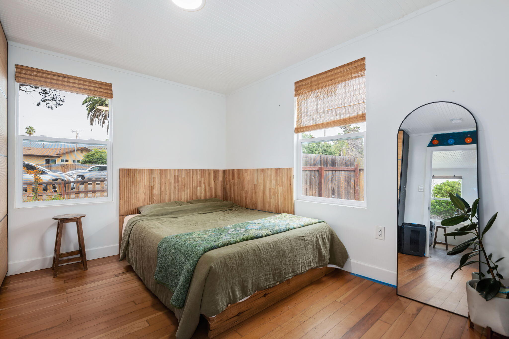 4621 7th Street Carpinteria, CA 93013 - Photo 8 of 16 a bedroom with a bed and a large window