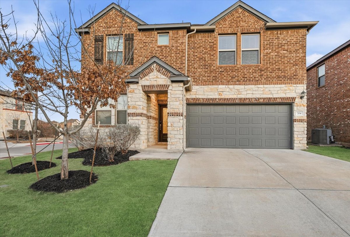 Welcome to 704 Aliso Trl, Leander! Lawn is digitally enhanced green.