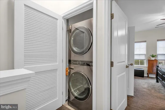 a view of a hallway with washer and dryer