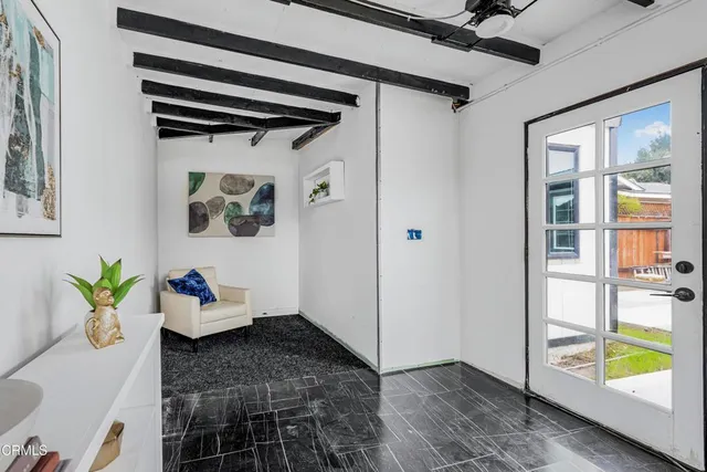 a view of an entryway door and hallway