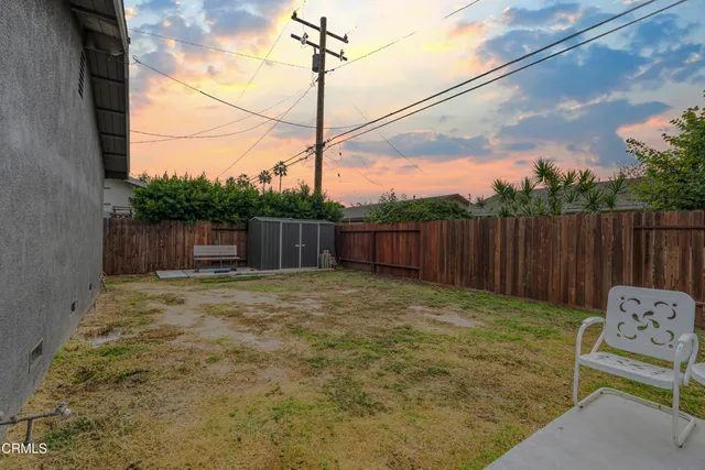 a backyard of a house with lots of green space