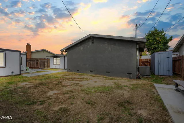 a view of a backyard of the house