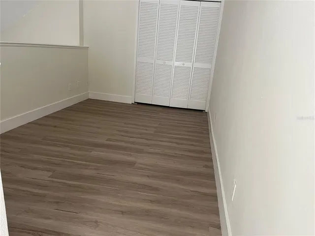 a view of a small space with wooden floor