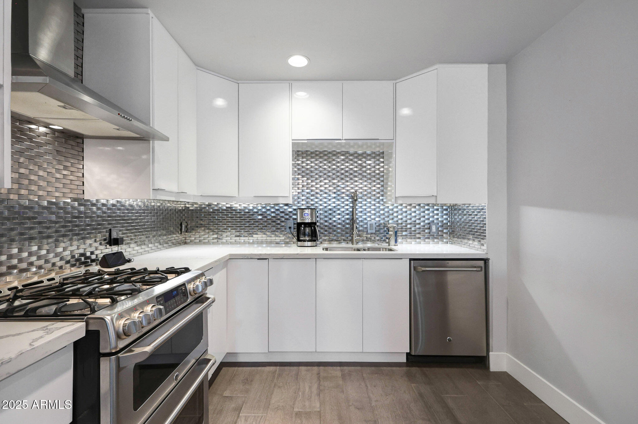 4435 North 35th Street Phoenix, AZ 85018 - Photo 11 of 35 a kitchen with granite countertop a sink stove and cabinets